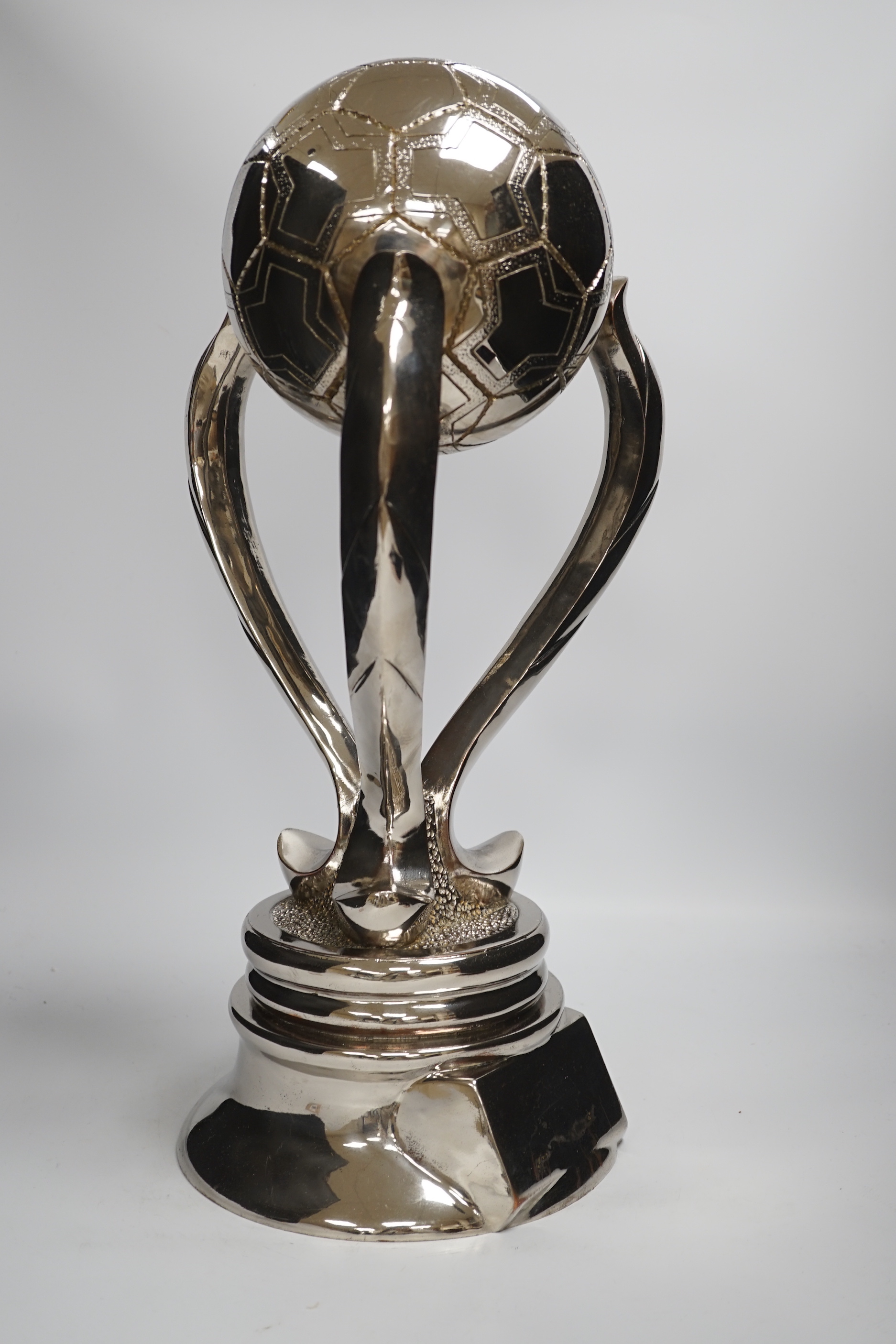 A chrome-plated football trophy, 51cm high